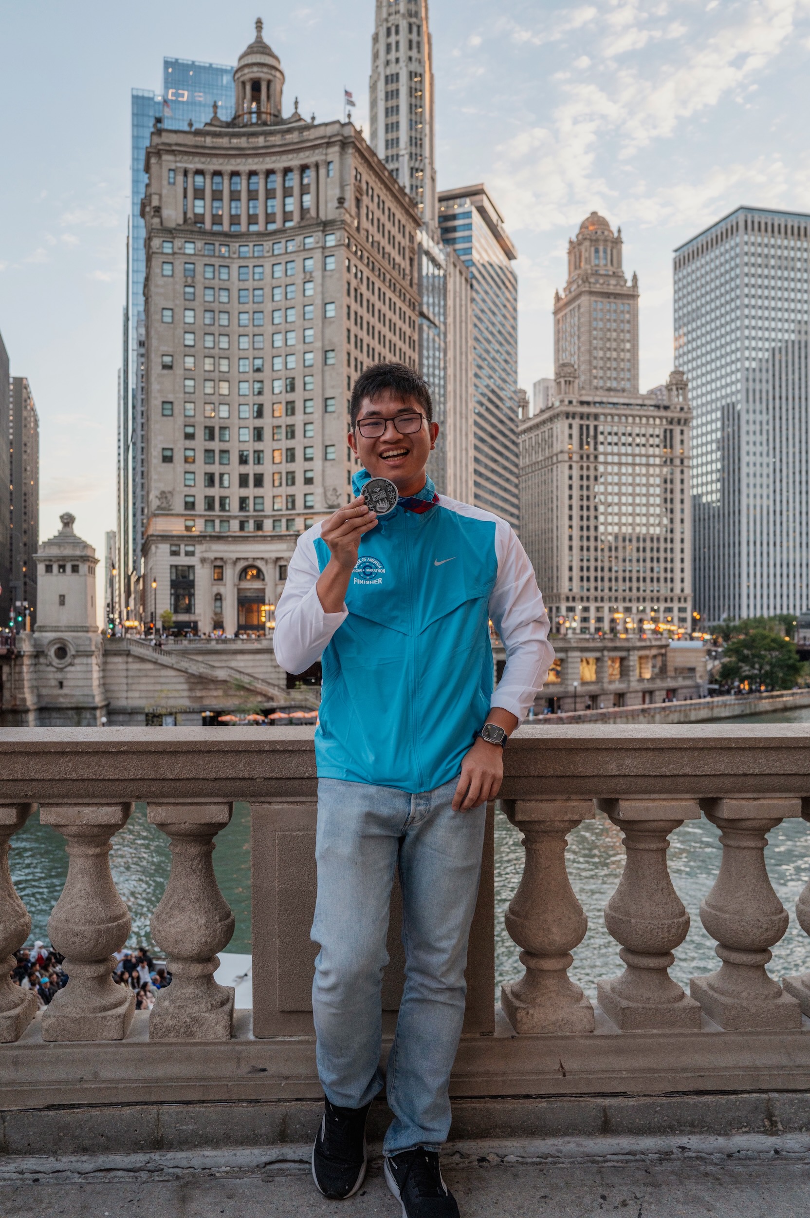 Daniel holding a finisher’s medal in Chicago